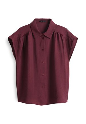 Short-sleeve, burgundy blouse with a button-up front and a structured collar, featuring subtle texture and relaxed fit design.