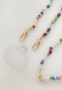 Colorful beaded lanyard with gold-tone clips, featuring varied shapes and sizes of beads, alongside a clear identification tag with a loop.