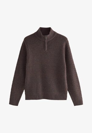 Barna, textúrált pulóver magas nyakkal és fél cipzárral. Gyémánt kötésmintával rendelkezik, valamint bordás mandzsettákkal és aljjal. Hétköznapi kialakítás.