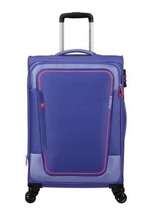 Purple suitcase with a textured finish, featuring a contrasting pink accent, extendable handle, and four black wheels for mobility.
