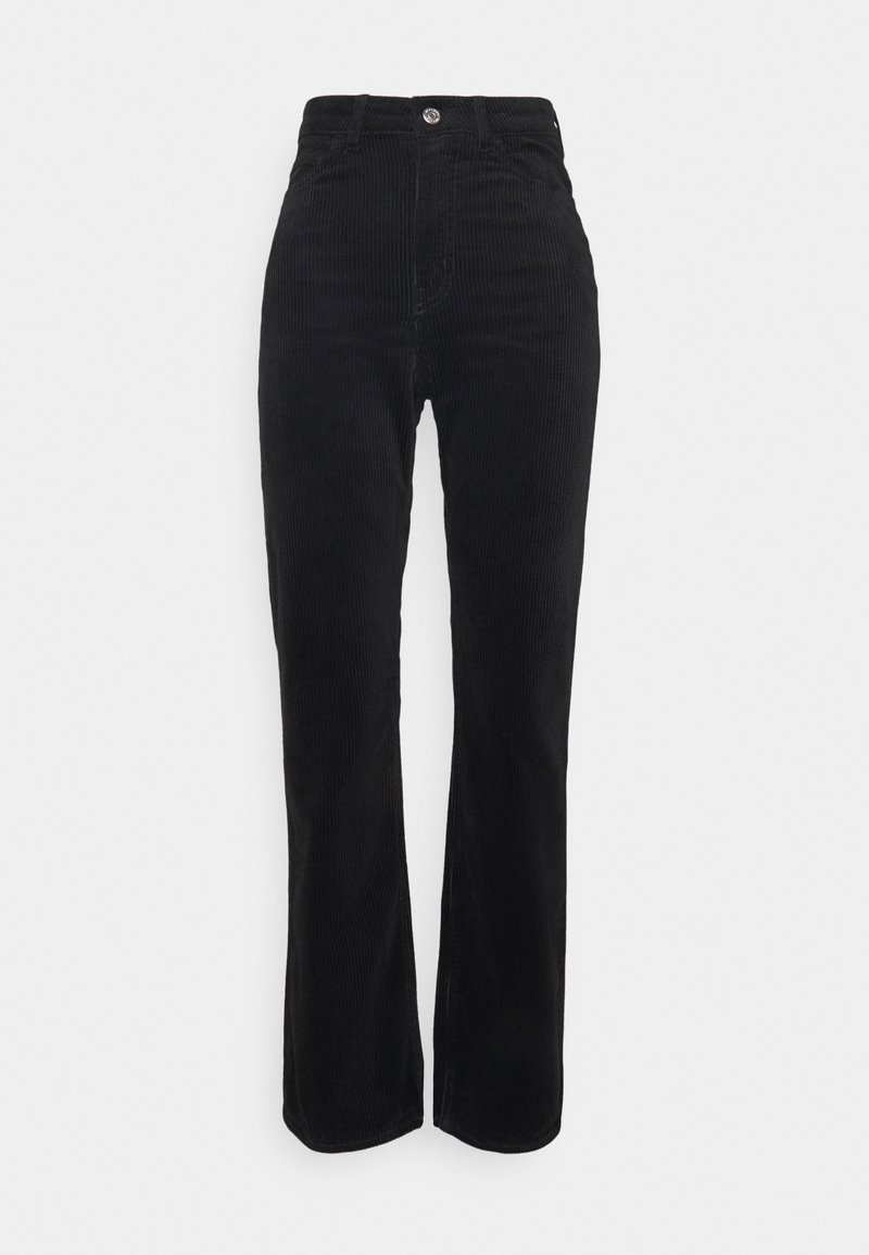 Pantalon en velours côtelé noir taille haute avec fermeture bouton et zip et jambes droites sur fond gris clair.