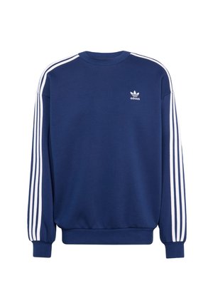 Mørkeblå genser laget av bomull, med hvite vertikale striper på ermene og en liten hvit Adidas-logo på brystet.