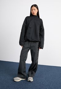 Nike Sportswear Treniņtērpa apakšdaļas - black