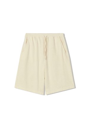 Beige shorts with an elastic waistband, drawstring, and side pockets; made of textured fabric with a relaxed, straight fit.