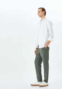 Koton SLIM FIT  - Chinos - green