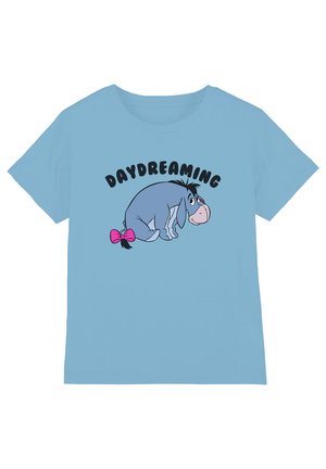Light blue shirt with a sad cartoon donkey wearing a pink bow on its tail and the word "DAYDREAMING" above it in black letters.