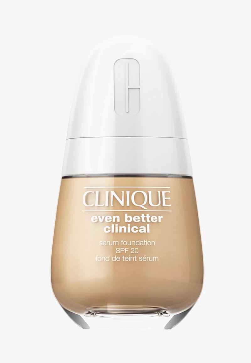 Clinique Even Better Clinical serum foundation i en klar flaske med rund form. Hvit kork, beige væske, SPF 20-merke på etiketten.