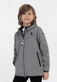 Pilkas užtrauktukas striukė su kapišonu, kontrastingais juodais akcentais, šoniniais kišenėmis ir priekyje dekoratyviu kaukolės motyvu. Lygus audinio paviršius.