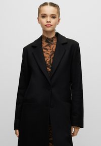 HUGO MOJENI - Klassisk kappa / rock - black one