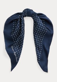 Navy silk scarf featuring white polka dots in a gradient pattern, tied in a knot at the top, with "Lauren Ralph Lauren" printed on one side.