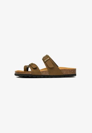 Brown sandal with two adjustable straps, cork footbed, and textured black rubber sole. Features metal hardware accents.