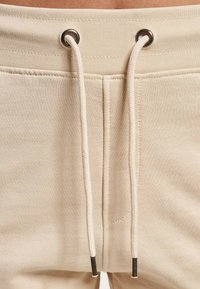 DEF GRETA - Verryttelyhousut - cream