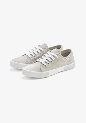 Light gray canvas sneakers with white laces, rubber soles, and stitched detailing. Features rounded toe and minimal branding on side.