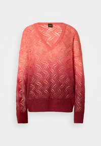 Pull en tricot gradient rose avec un col en V, présentant un motif géométrique, des manches longues et une finition texturée à l'ourlet et aux poignets.