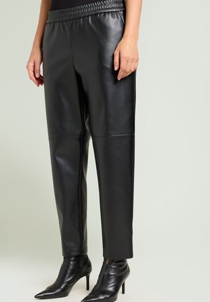 PULL-ON IN SPALMATO - Leren broek - nero