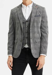 Grå rutig blazer med en strukturerad design, med slagkrage, två framfickor och kontrasterande knappar. Kombinerad med en matchande väst.
