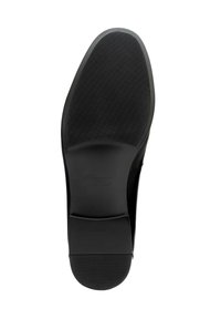 Schwarze Lederschuhsohle mit strukturierter Oberfläche, einem glatten Bereich an der Ferse und eingraviertem Markenlogo, flaches und flexibles Design.