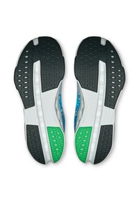 Sportliche Schuhe mit einer schwarzen, weißen und grünen Gummisohle. Sie verfügen über eine gummierte Textur, hexagonale Muster und ein himmelblaues Oberflächen-Design.