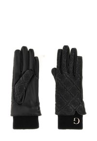 Pair of black leather gloves with quilted patterned backs, knit cuffs, and a small metallic "D" charm on one cuff.