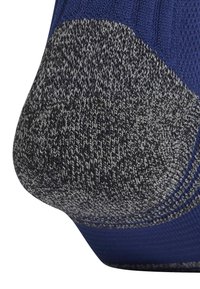 Pletená ponožka s modrým horním dílem a šedou texturovanou patou s vzorovaným pletením. Oblast paty je zesílena pro zvýšenou odolnost.