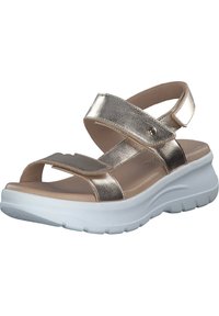 Metalliska guldplattformssandaletter med öppen tå, justerbara remmar och vit gummisula. Slät textur med minimalistiska designfunktioner.