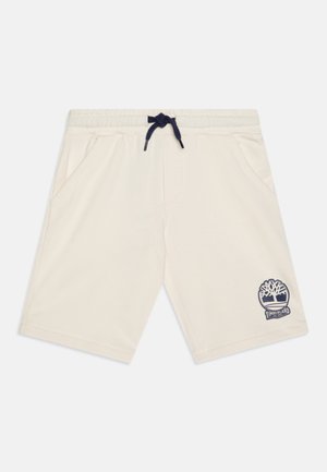 Cremfarbene Shorts aus weichem Material, mit einem navyfarbenen Kordelzugbund und Seitentaschen. Ein navyfarbenes Timberland-Logo befindet sich am linken Bein.