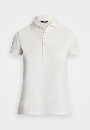 Polo shirt bianco realizzato in cotone testurizzato, con colletto classico, patta con tre bottoni e logo ricamato sottile sul petto.