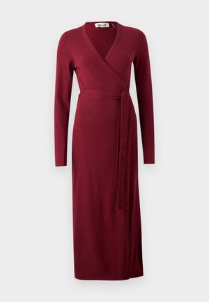 Burgundy wrap dress made of soft fabric, featuring long sleeves, a V-neck, and a tie closure at the waist, with a straight hem.
