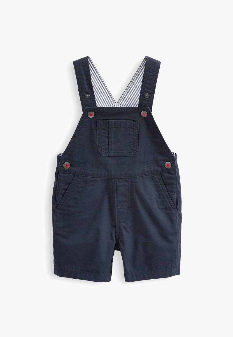 Salopette courte bleu marine pour tout-petit avec boutons rouges, poche avant, poches latérales et doublure rayée sur les bretelles.