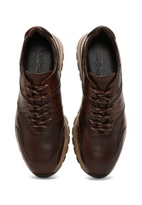 Pair of brown textured leather sneakers with round toes, patterned laces, and beige rubber soles, viewed from above.