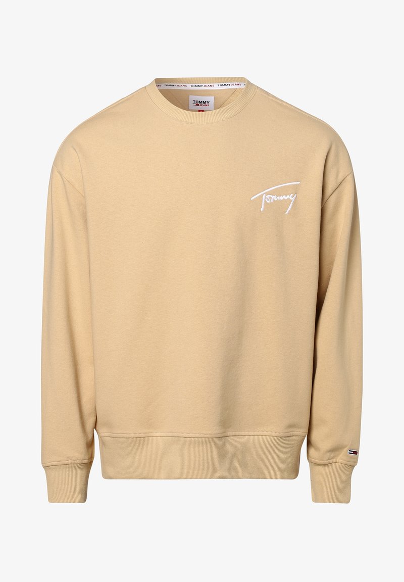 Beige huppari, joka on valmistettu puuvillasta. Siinä on pyöreä kaula-aukko, resorihihat ja pieni valkoinen logo rinnassa. Pehmeä pinta ja rento muotoilu.