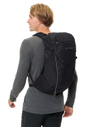 Zaino Vaude nero con forma arrotondata, spallacci regolabili, tessuto testurizzato, cordini elastici frontali e dettaglio del logo su un lato.