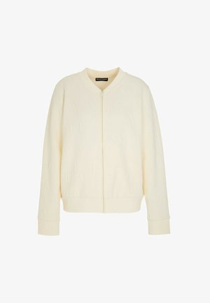 Giacca bomber color crema con zip frontale, motivo a lettere goffrate, polsini e orlo a coste. Realizzata in tessuto morbido; vestibilità comoda.