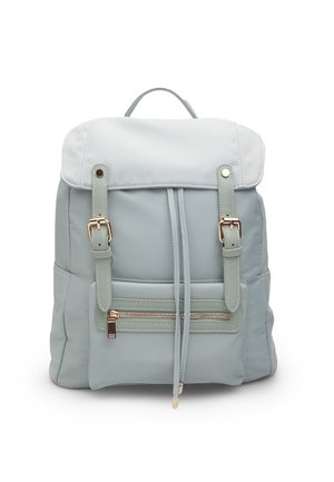 Light blue backpack made of synthetic material with a soft texture, featuring adjustable straps, a front zipper pocket, and a flap closure.