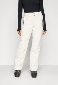 Hvite skibukser med slim fit, med to frontlommer med glidelås, en midje med to knappholdere og forsterkede sømmer.