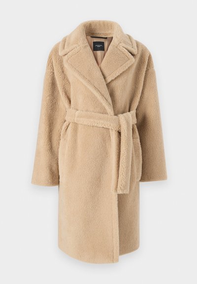 Beige, fuzzy coat with a shawl collar, long sleeves, and a tied belt. Features an open front and a soft, textured fabric.