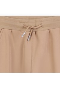 BOSS Kidswear JUNIOR JOGGING BOTTOMS - Treniņtērpa apakšdaļas - cookie