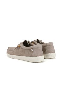 Light gray suede slip-on shoes with a textured white rubber sole, contrasting brown laces, and a small logo patch on the heel.