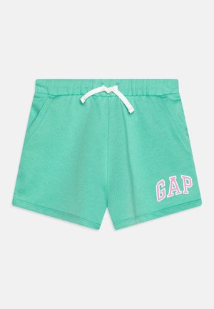 Mintgrønne casual shorts med elastisk talje og hvid snor, med pink og hvid "GAP" tekst på venstre ben.