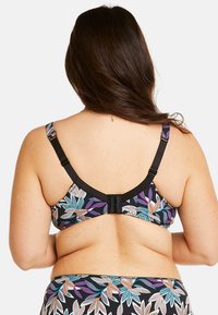 Soutien-gorge noir avec un motif de feuilles multicolores, bretelles réglables et un fermoir à crochet et œil dans le dos.