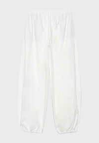 Pantalon blanc ample avec taille élastique et poignets élastiques froncés, présenté sur un fond clair uni.