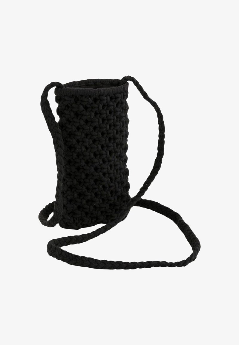 Black woven bag with a cylindrical shape, featuring a textured surface, long braided strap, and an opening at the top.