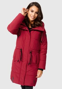 Red puffer parka with a hood, cinched waist drawstring, zipper pockets, and a quilted texture. Features black accents and a waterproof lining.