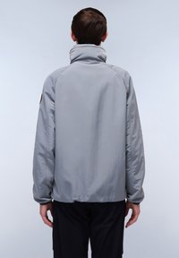 Gray lightweight jacket with a high collar, elastic cuffs, and a smooth texture. Features a simple, clean design with no visible hardware.