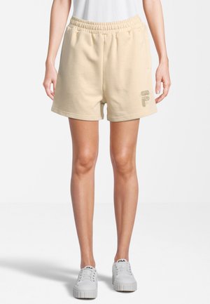 Pantaloni corti in misto cotone beige con vita elasticizzata, tasche laterali e un discreto logo sulla parte anteriore. Tessuto liscio e vestibilità morbida.