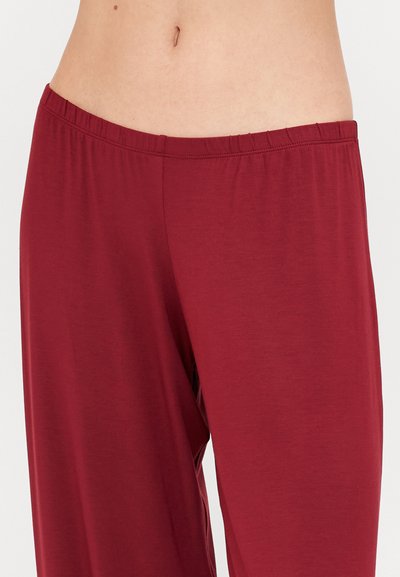 Red, lightweight, relaxed-fit pants with an elastic waistband, featuring a smooth texture and a straight cut from the waist down.