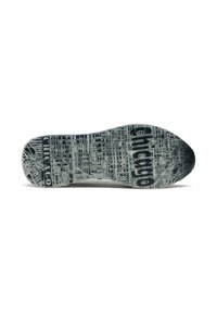 Suela de una zapatilla deportiva, con un patrón texturizado de líneas de cuadrícula de ciudad en gris y negro, con la palabra "Chicago" destacada.