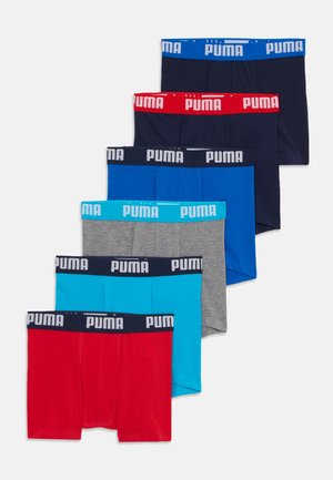 Zeven paar boxershorts in de kleuren: rood, grijs, marineblauw, blauw en lichtblauw, elk met een merk-elastische tailleband.