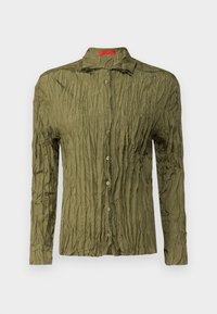 Olive green, long-sleeve shirt with a wrinkled texture, button front, and a chest pocket; features a pointed collar and subtle sheen.