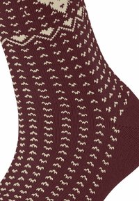 Chaussette tricotée bordeaux avec des motifs zigzag et des pois crème, fabriquée en tissu doux avec une texture côtelée. Détails accentués au niveau des orteils et du talon.